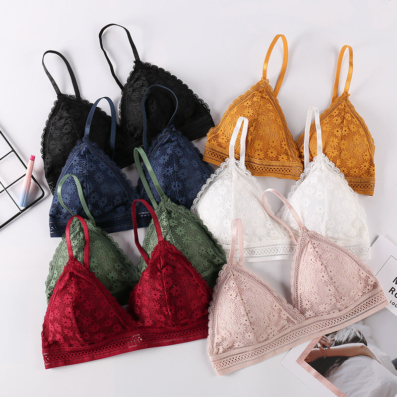 Multi-Color Shelliy Bralettes Fanned Out On White Surface — Flat-lay