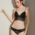 Black Shelliy Bra Model With Hand On Wall Looking Down — On-body