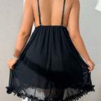 Black mesh babydoll nightdress on model, back view against an interior wall — Shelliy Coquette